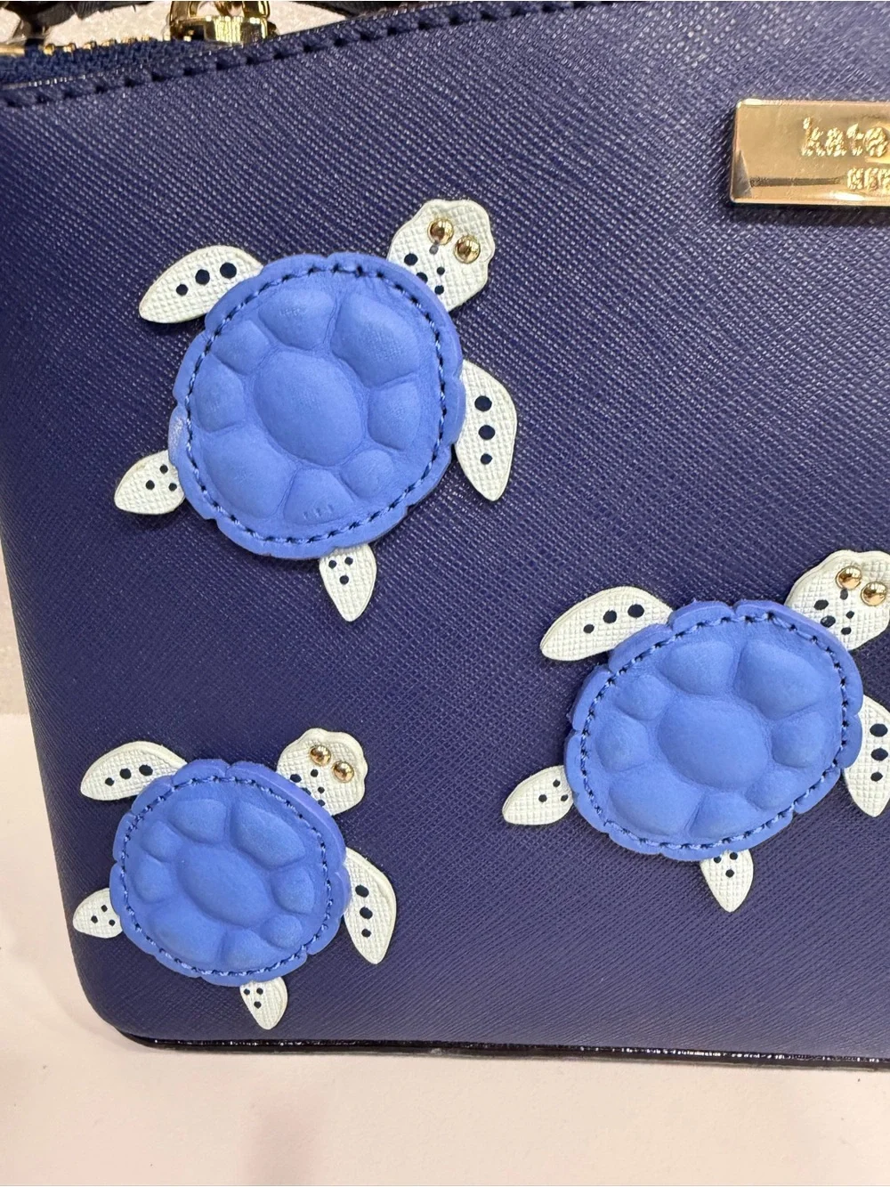 kate spade navy leather crossbody with blue sea turtle appliqués